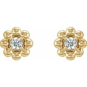 April 0.06 CTW Natural Diamond Petite Flower Birthstone Stud Earrings pair view in 14K yellow gold