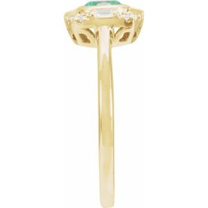 Natural emerald and diamond halo ring side profile in 14K yellow gold
